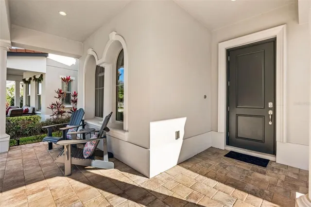 a kitchen with white cabinets and appliances