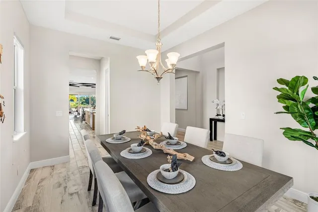a large kitchen with a table and chairs