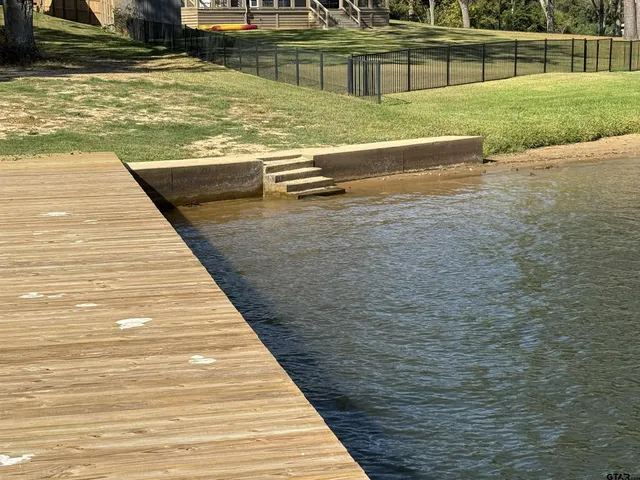 a kitchen with a refrigerator and a stove