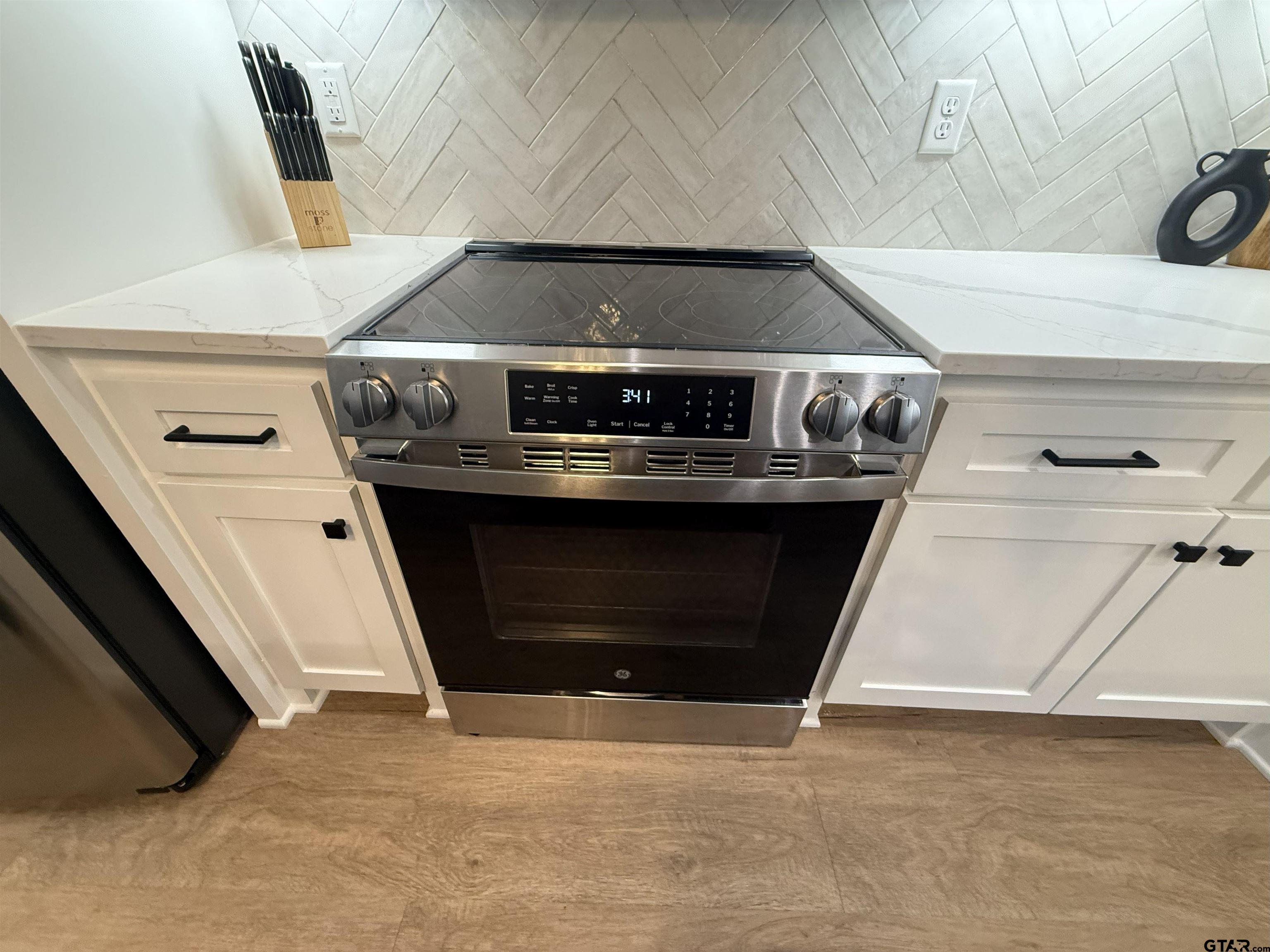 16093 County Road 189 West Flint, TX 75762 - Photo 23 of 46 a stove top oven sitting inside of a kitchen