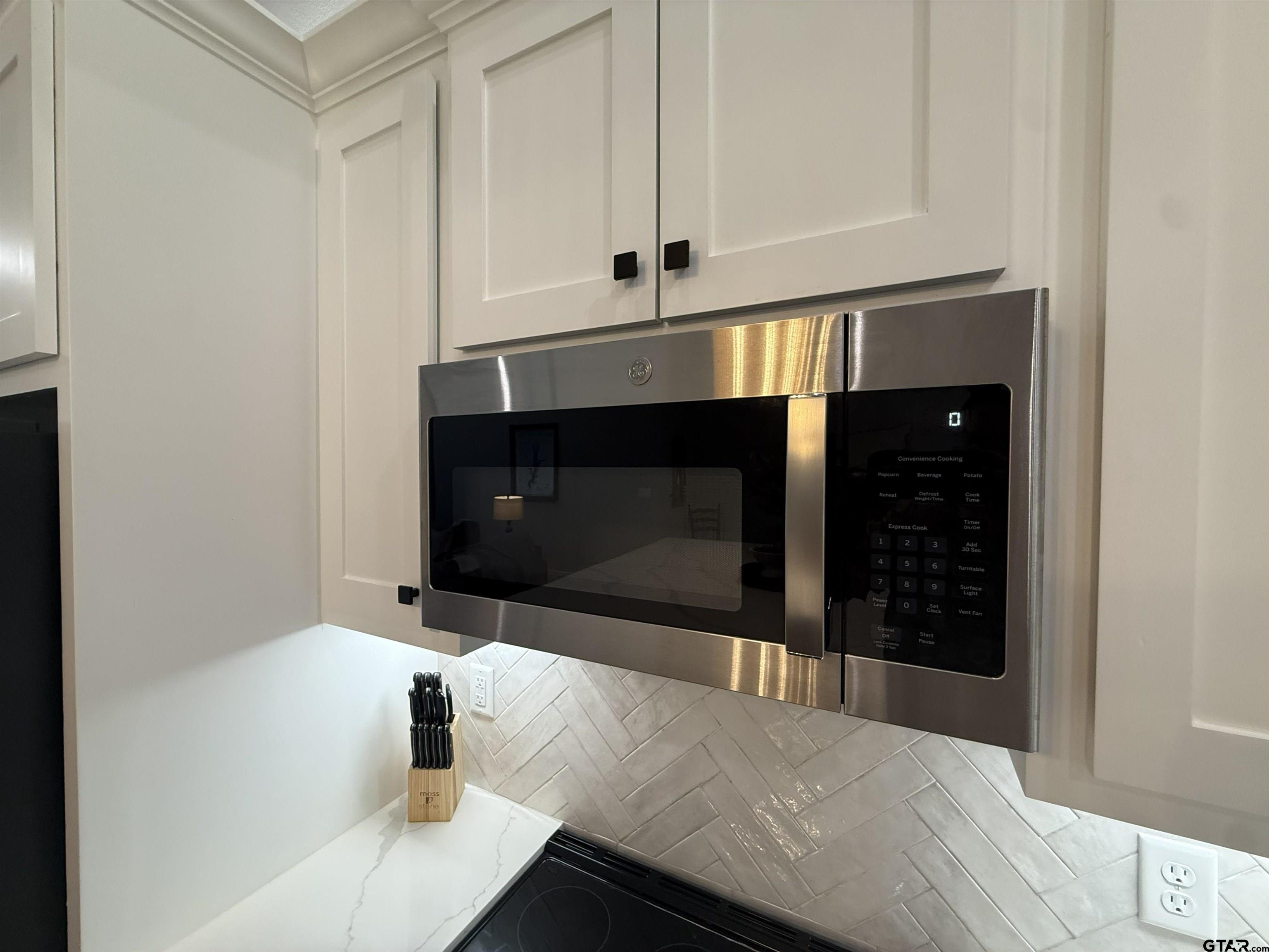 16093 County Road 189 West Flint, TX 75762 - Photo 24 of 46 a kitchen with a stove and a white cabinet