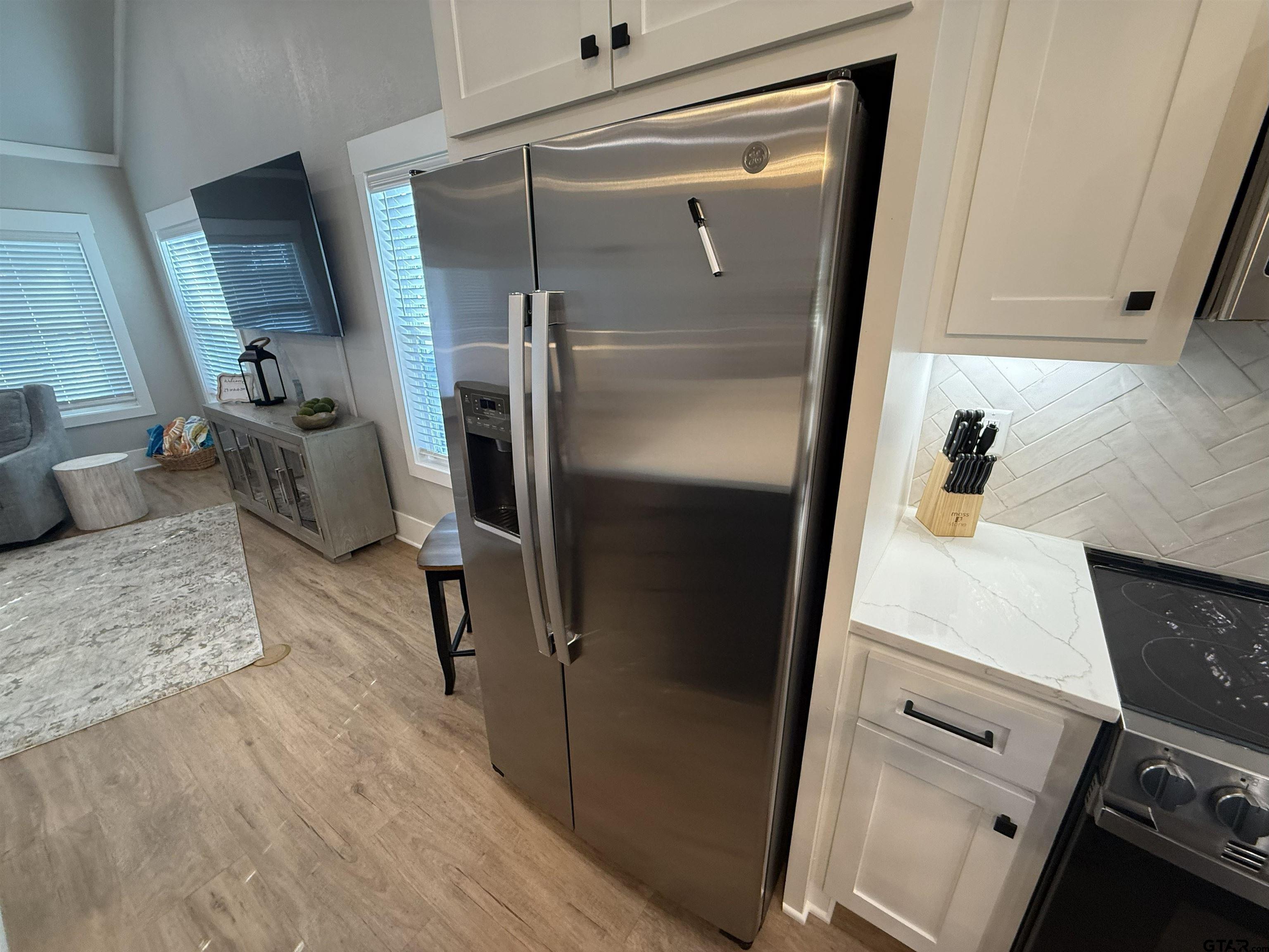 16093 County Road 189 West Flint, TX 75762 - Photo 25 of 46 a kitchen with a refrigerator and a stove