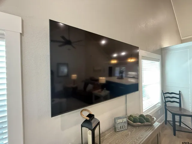 a small space with a toilet and a mirror