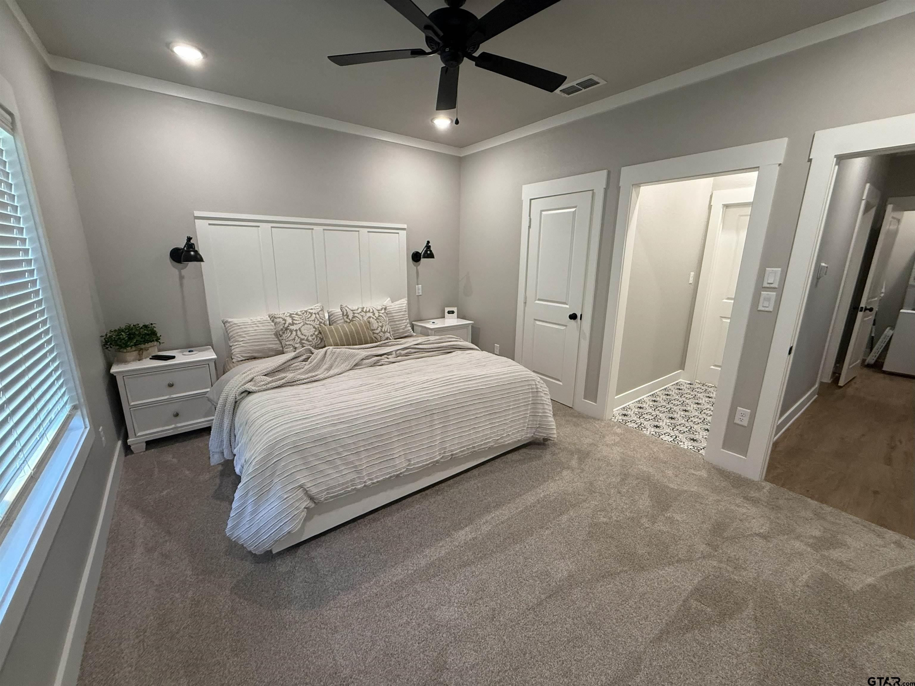 16093 County Road 189 West Flint, TX 75762 - Photo 31 of 46 a bedroom with a bed and a chandelier