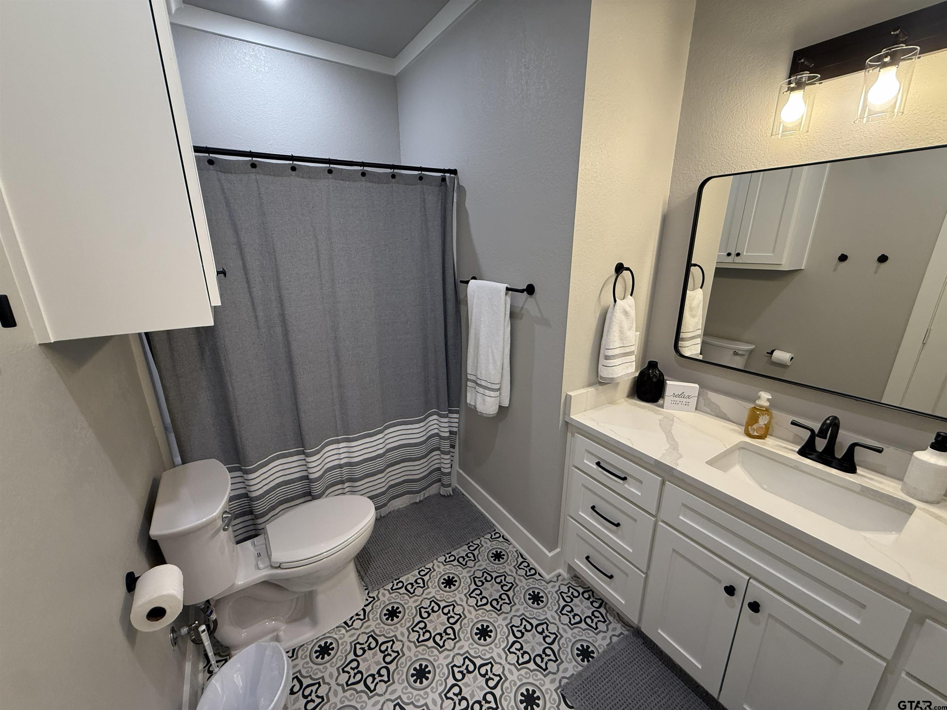 16093 County Road 189 West Flint, TX 75762 - Photo 35 of 46 a bathroom with a sink toilet and shower