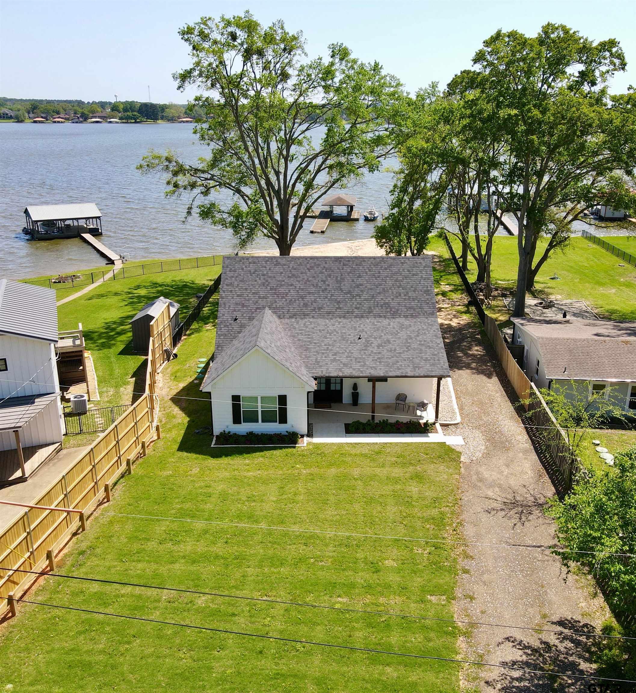 16093 County Road 189 West Flint, TX 75762 - Photo 4 of 46 a view of a house with pool and lawn chairs under an umbrella