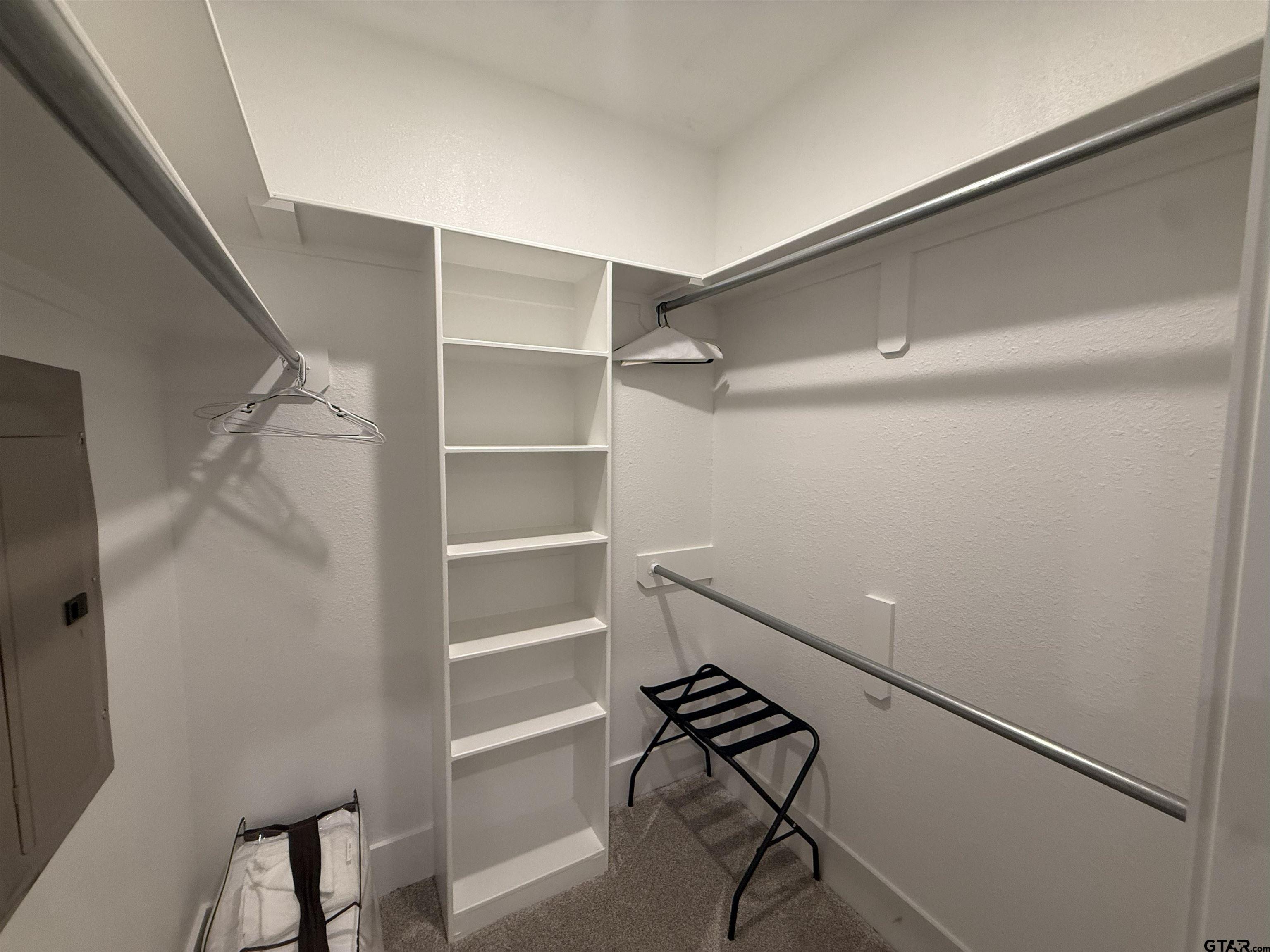 16093 County Road 189 West Flint, TX 75762 - Photo 41 of 46 a room with walk in closet and wooden floor