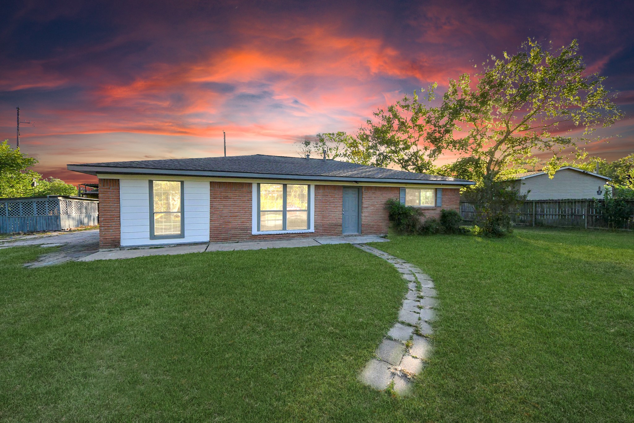 front view of a house with a yard