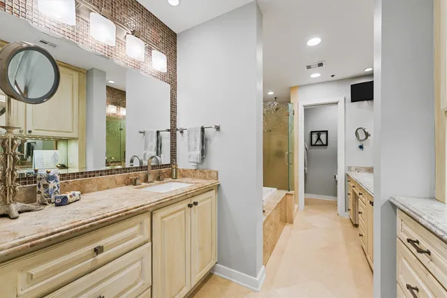 a spacious bathroom with a sink double vanity and a mirror