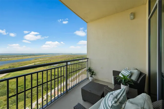 a view of balcony with furniture