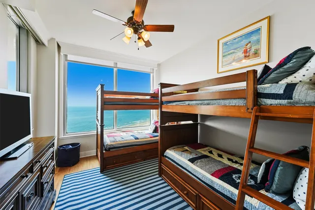 a bedroom with furniture and a window