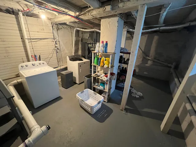 a view of walk in closet with clothes