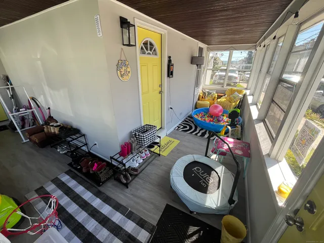 a room with toys and wooden floor