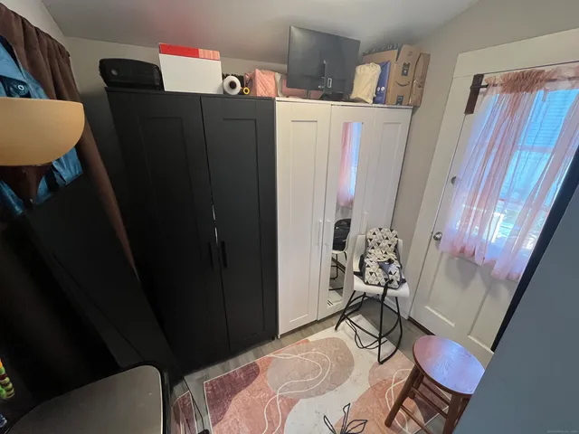 a bedroom with a bed and furniture