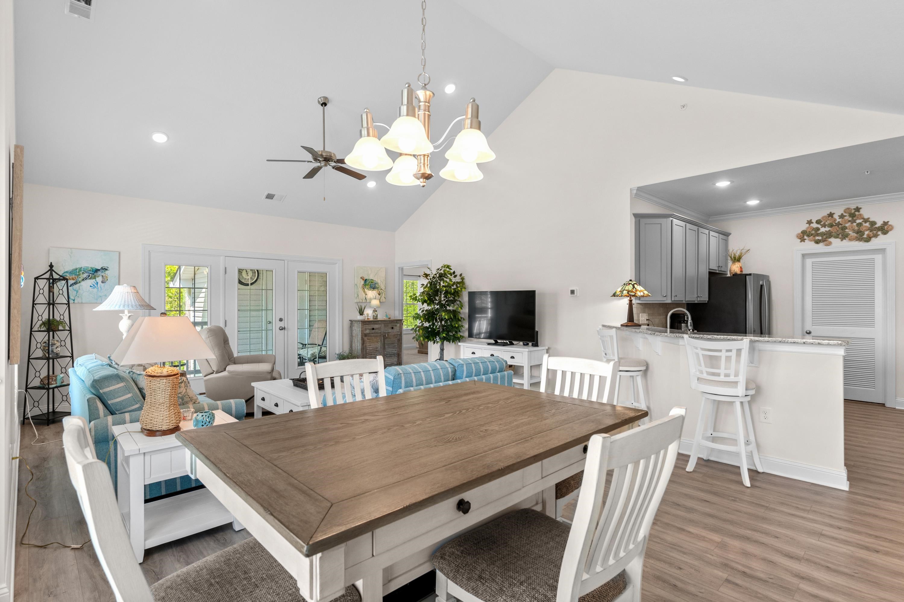 948 Jackline Place, Unit 201 Murrells Inlet, SC 29576 - Photo 13 of 37 Dining area featuring high vaulted ceiling, light wood finished floors, recessed lighting, and a chandelier