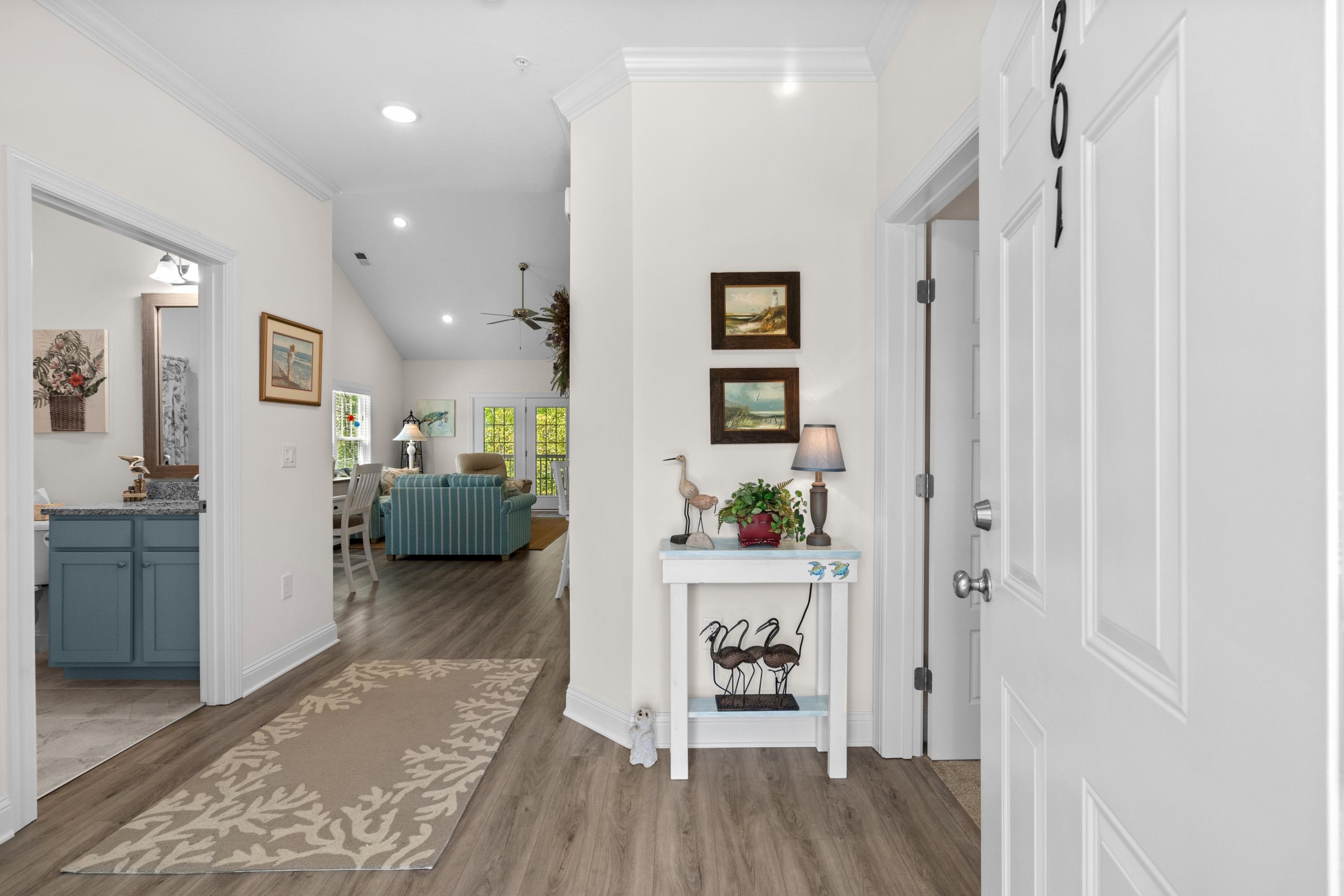 948 Jackline Place, Unit 201 Murrells Inlet, SC 29576 - Photo 2 of 37 Hallway featuring vaulted ceiling, light wood-style floors, crown molding, and recessed lighting