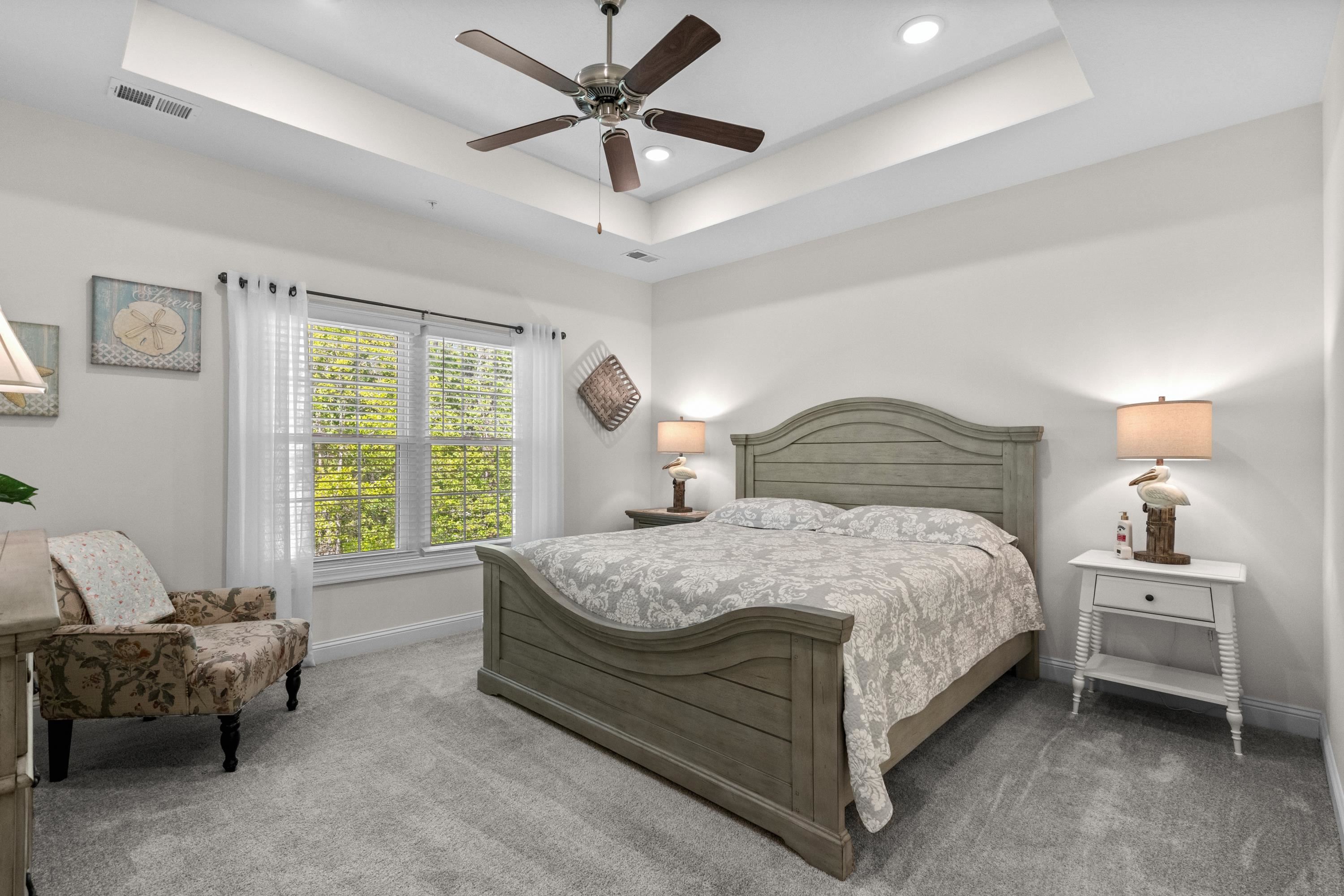 948 Jackline Place, Unit 201 Murrells Inlet, SC 29576 - Photo 21 of 37 Carpeted bedroom featuring recessed lighting, a ceiling fan, and a tray ceiling