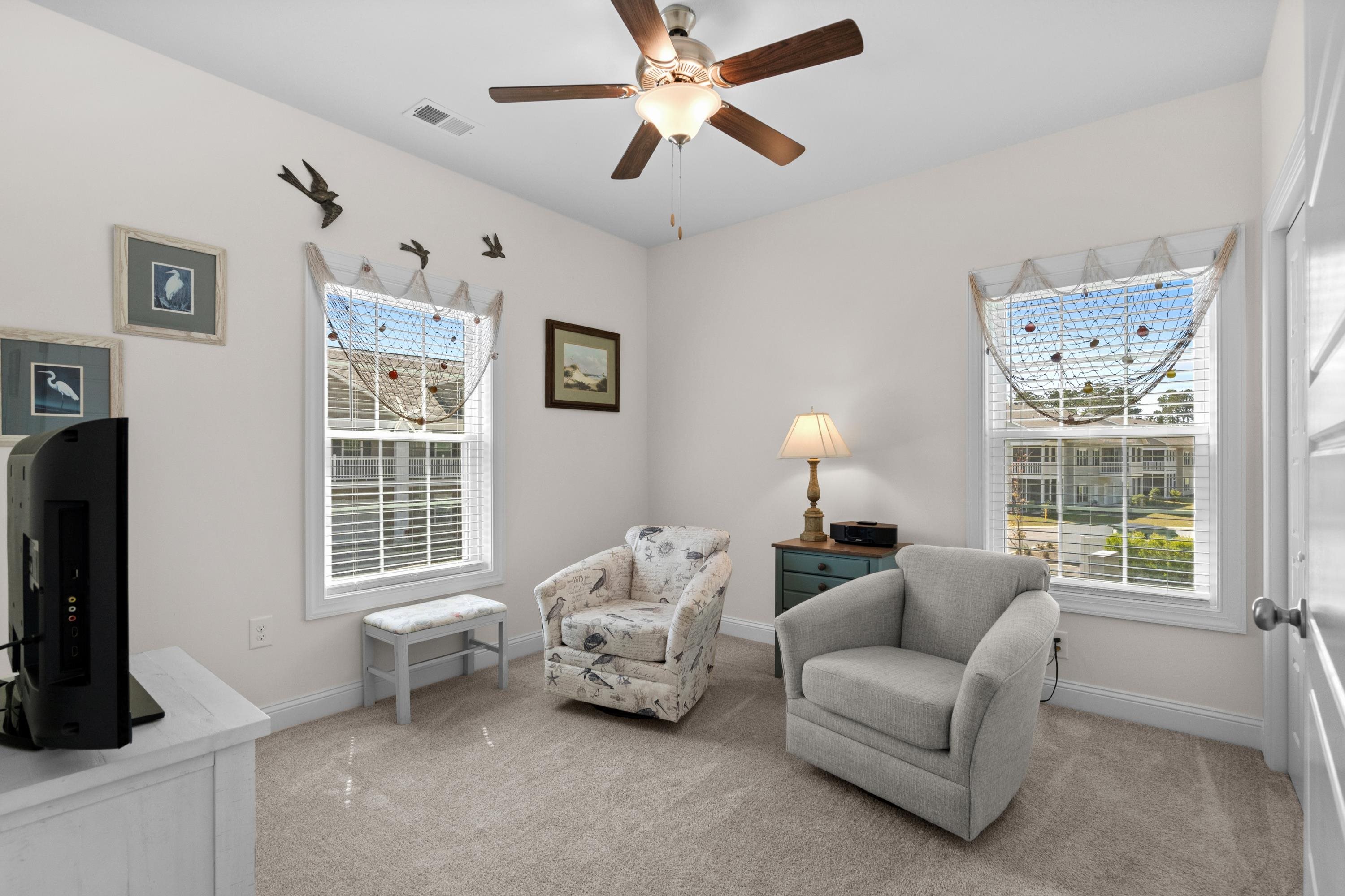 948 Jackline Place, Unit 201 Murrells Inlet, SC 29576 - Photo 25 of 37 Sitting room with light carpet and ceiling fan