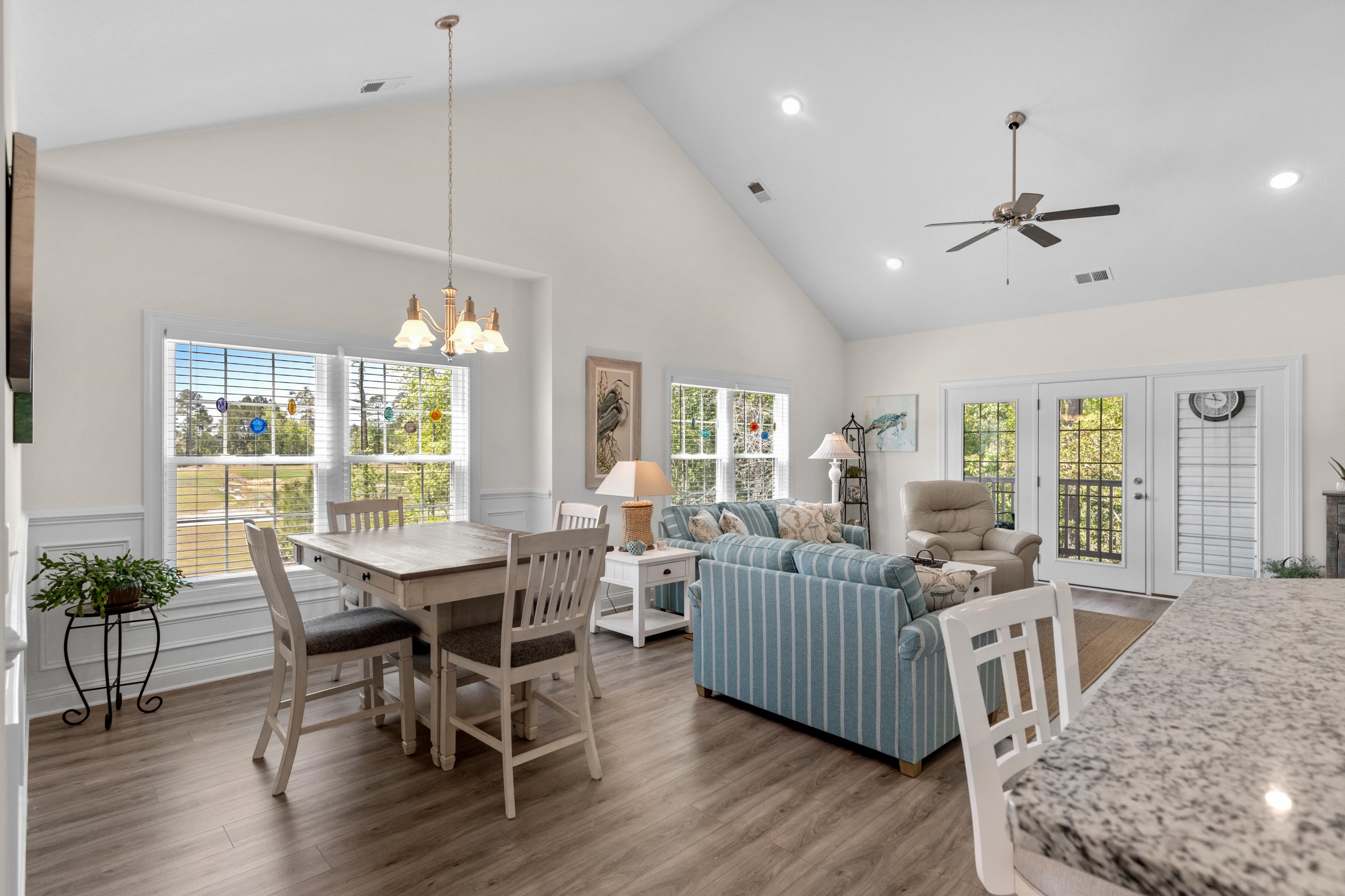 948 Jackline Place, Unit 201 Murrells Inlet, SC 29576 - Photo 5 of 37 Dining room featuring high vaulted ceiling, wood finished floors, plenty of natural light, recessed lighting, and a chandelier