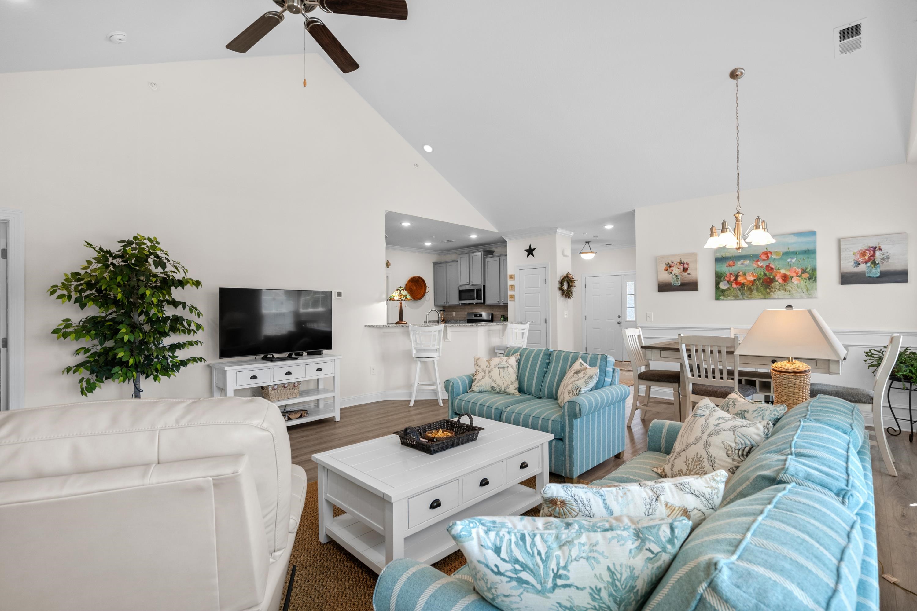 948 Jackline Place, Unit 201 Murrells Inlet, SC 29576 - Photo 10 of 37 Living area with a ceiling fan, wood finished floors, high vaulted ceiling, a chandelier, and recessed lighting