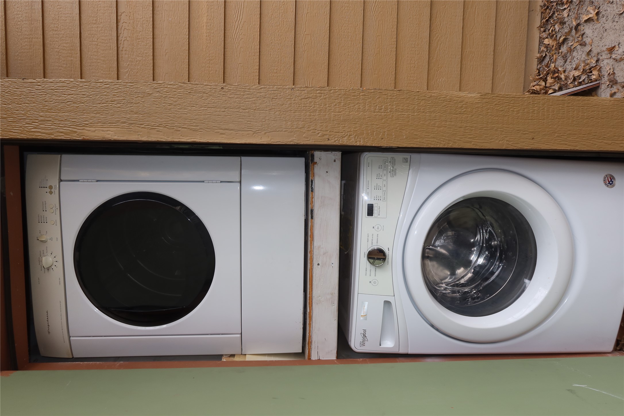 2802 Nueces Street, Unit 306 Austin, TX 78705 - Photo 16 of 20 Stackable washer and dryer unit, featuring a white finish and front-loading design, situated within a recessed alcove