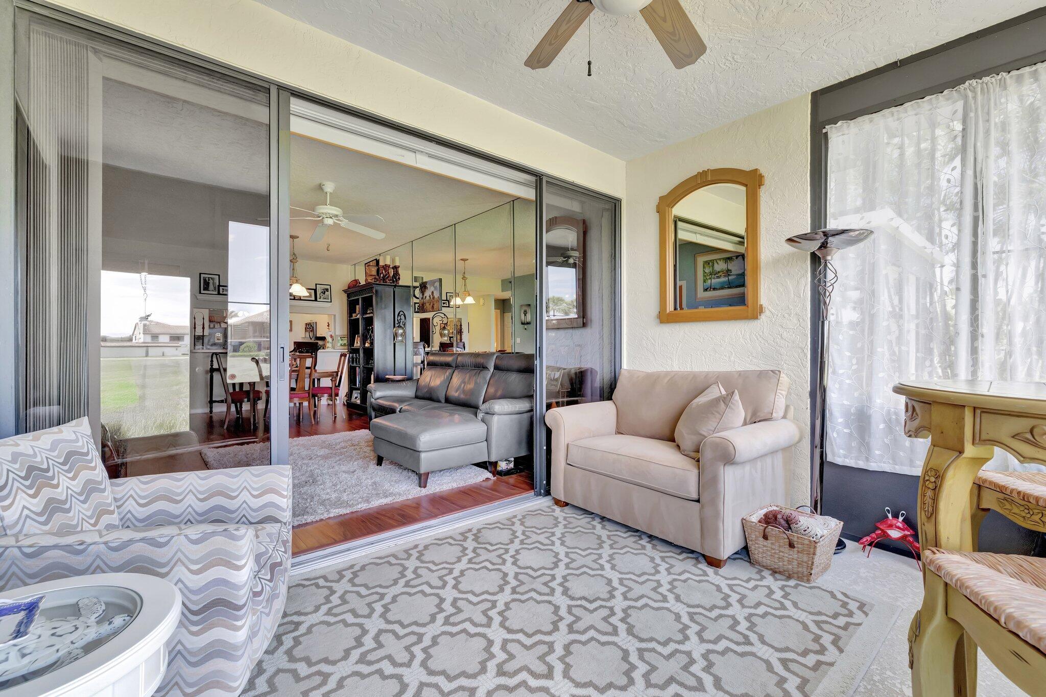 6062 Southeast Landing Way, Unit 2 Stuart, FL 34997 - Photo 14 of 36 Sun Room