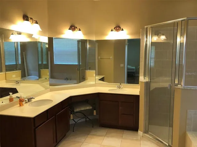 a bathroom with a sink and mirror