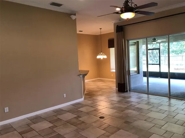 a view of a hallway with a chandelier