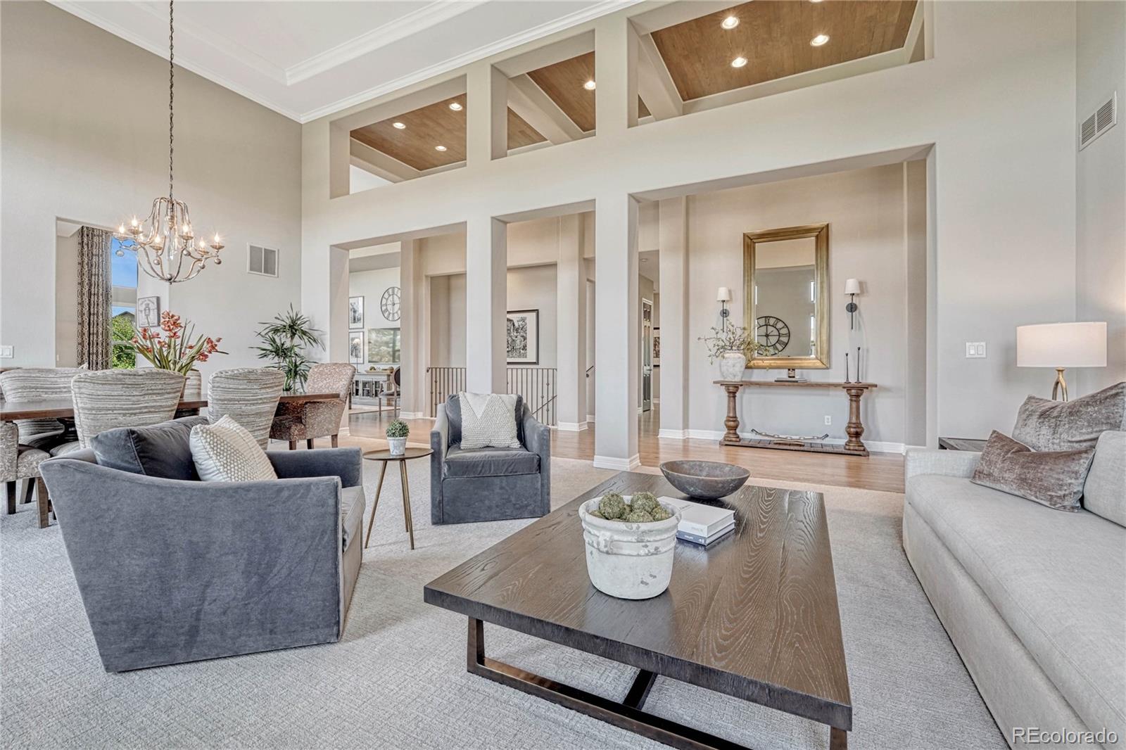 20125 East Shady Ridge Road Parker, CO 80134 - Photo 12 of 40 a living room with furniture and a table