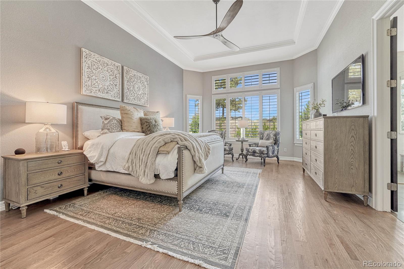 20125 East Shady Ridge Road Parker, CO 80134 - Photo 14 of 40 a living room with a bed furniture and a window