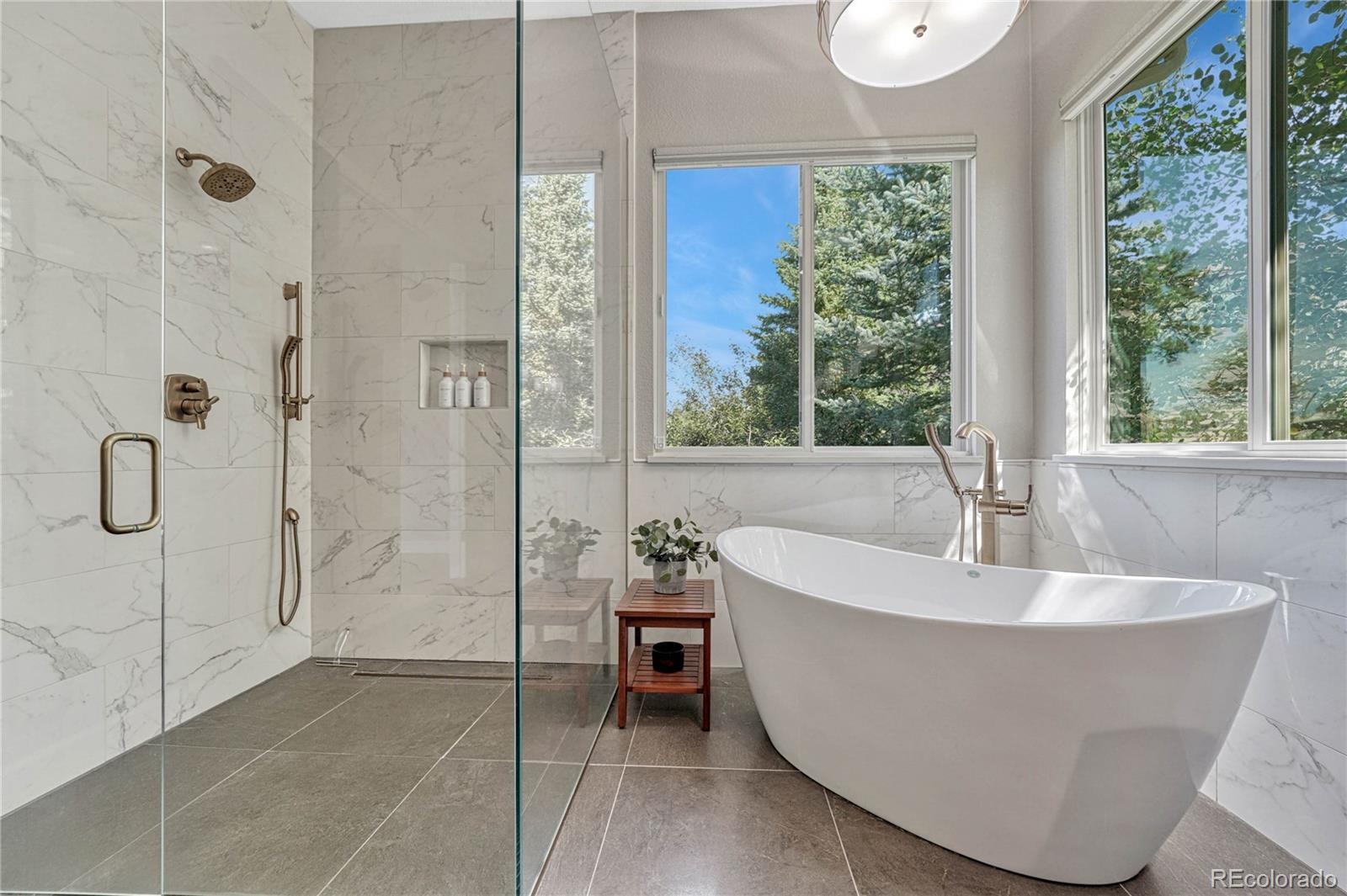 20125 East Shady Ridge Road Parker, CO 80134 - Photo 17 of 40 a white bath tub sitting in a bathroom next to a window