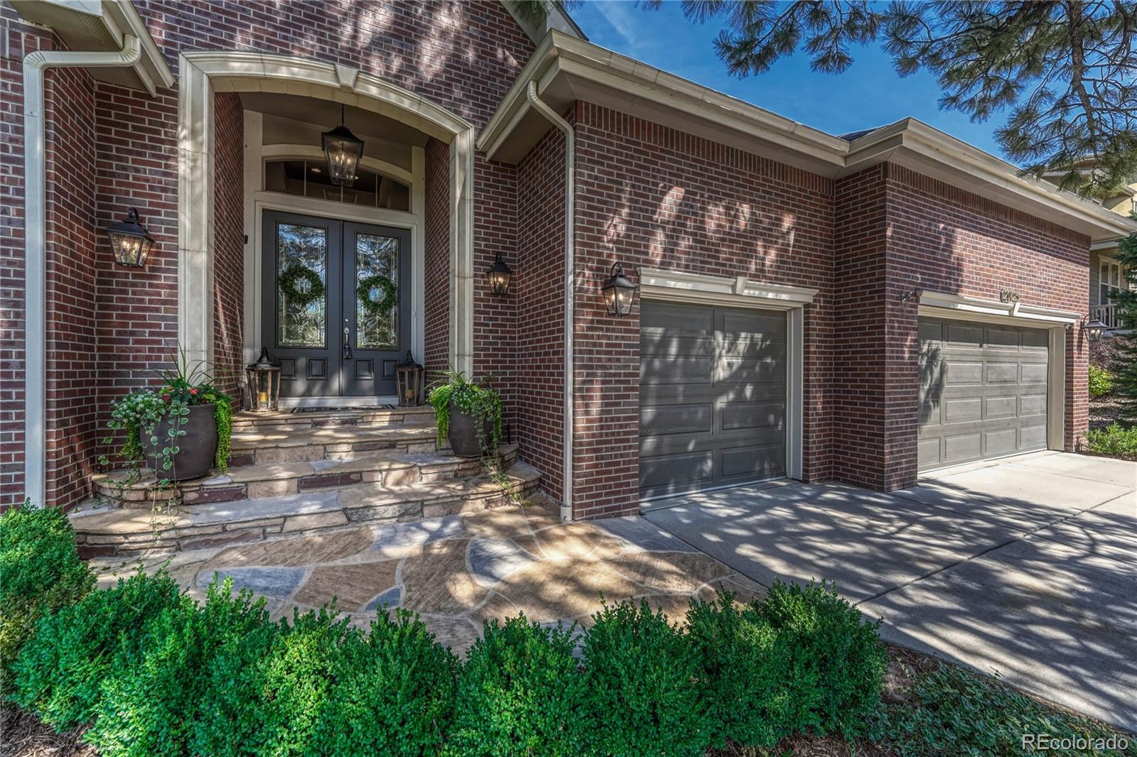 20125 East Shady Ridge Road Parker, CO 80134 - Photo 2 of 40 a view of a house with backyard of the house