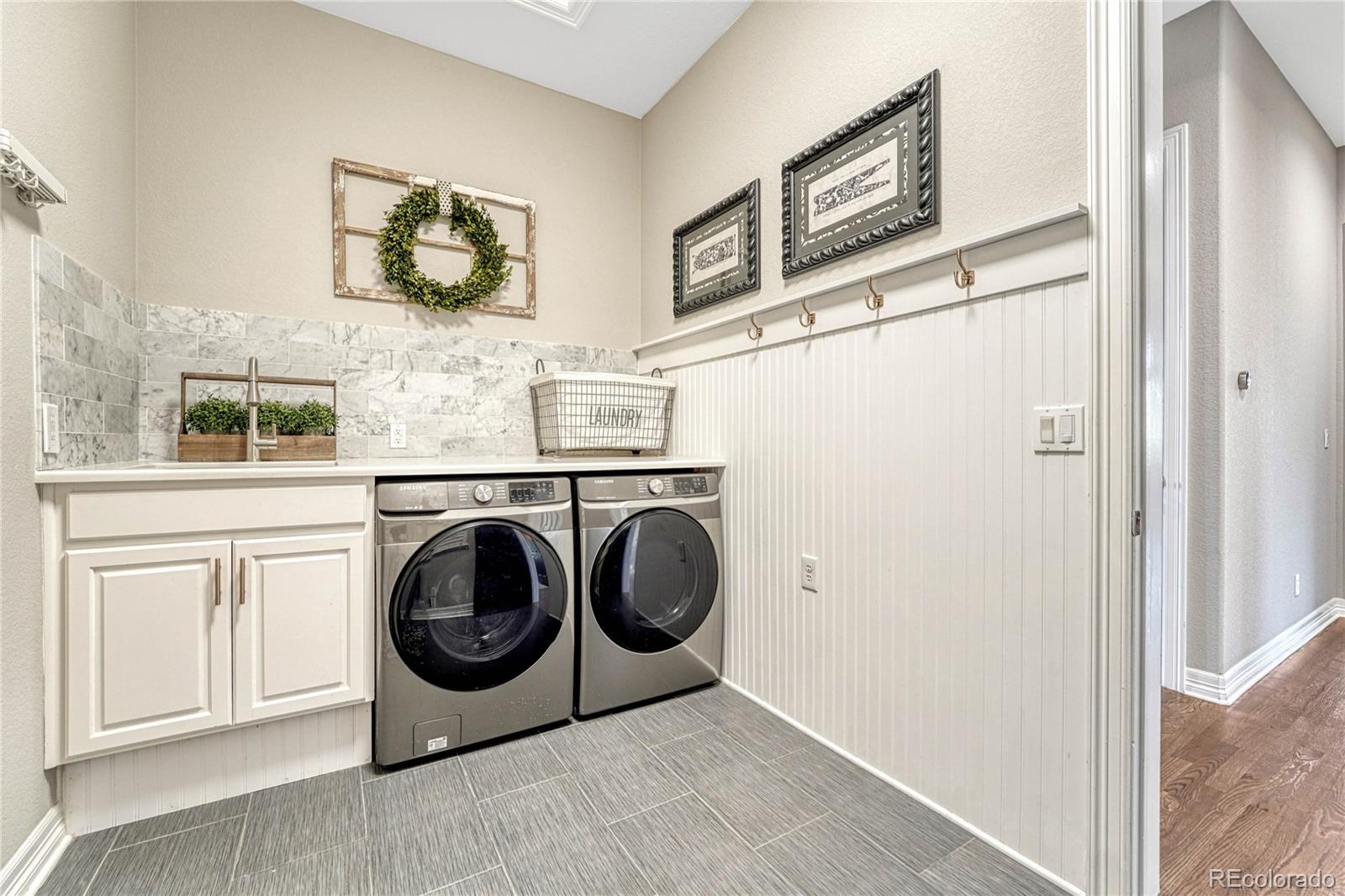 20125 East Shady Ridge Road Parker, CO 80134 - Photo 21 of 40 a utility room with dryer and washer