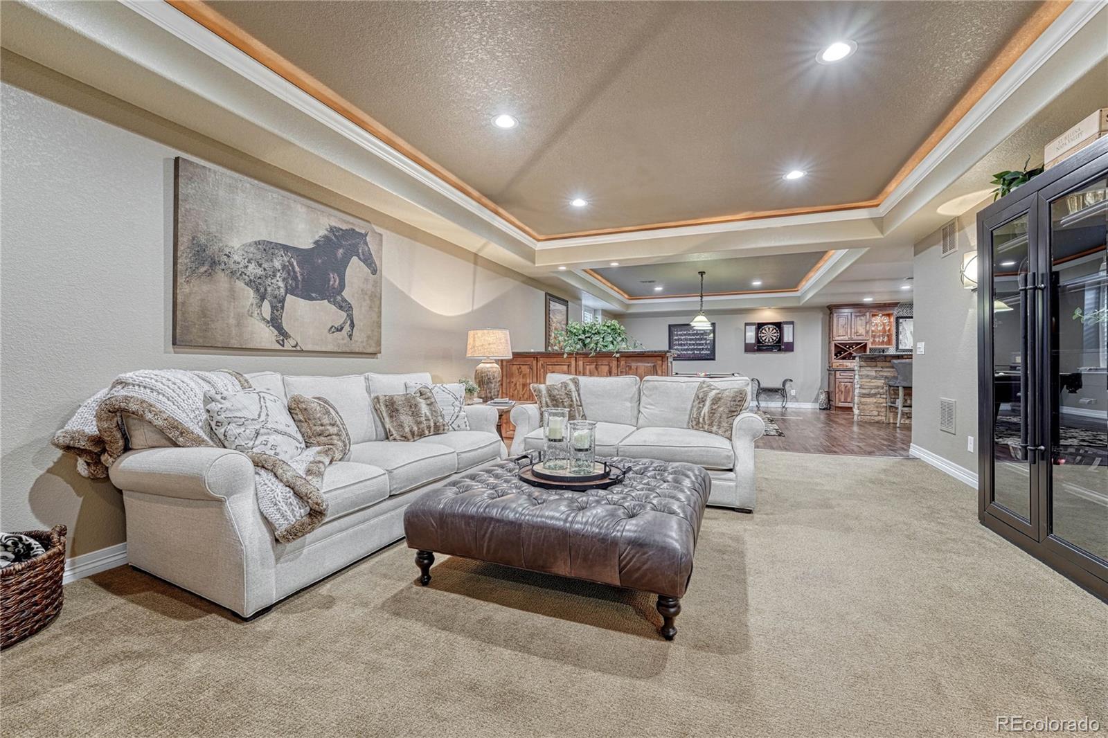 20125 East Shady Ridge Road Parker, CO 80134 - Photo 29 of 40 a living room with furniture and a large window