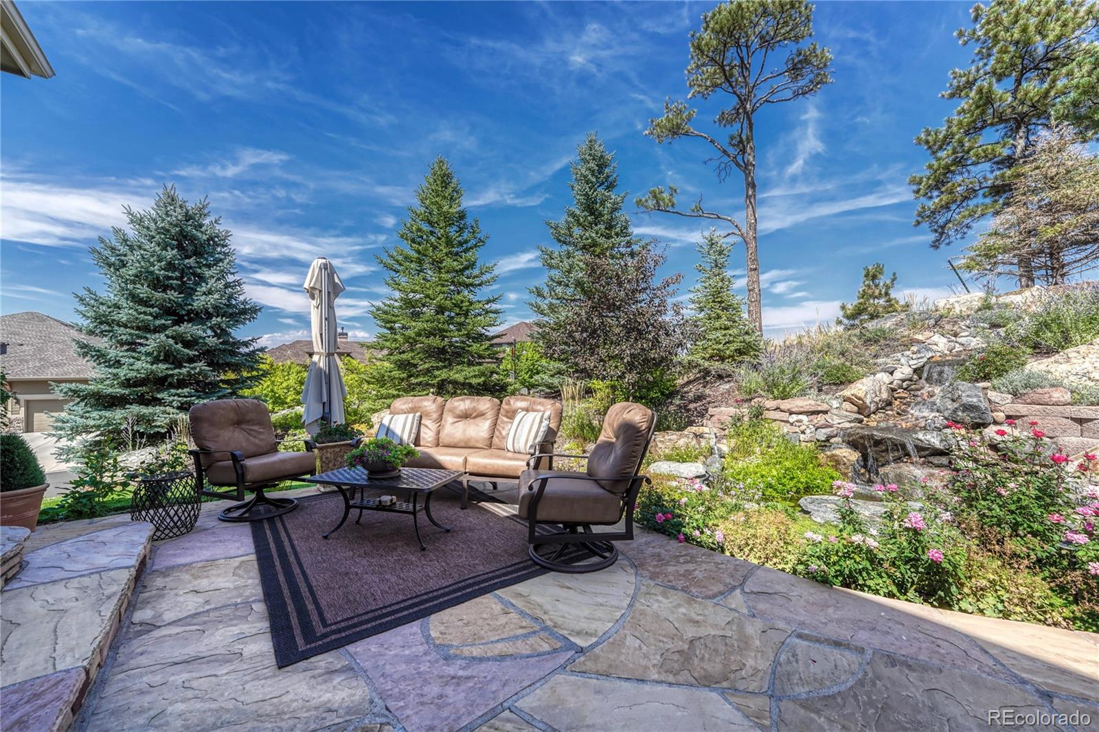 20125 East Shady Ridge Road Parker, CO 80134 - Photo 34 of 40 a view of a patio with table and chairs and potted plants