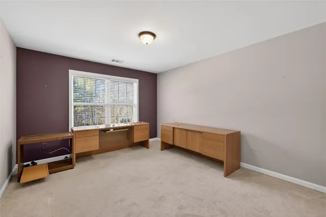 a room with a bed and a desk