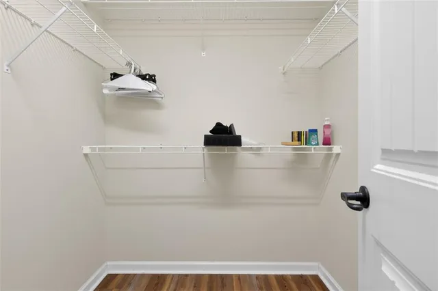 a bathroom with a bathtub sink mirror and toilet