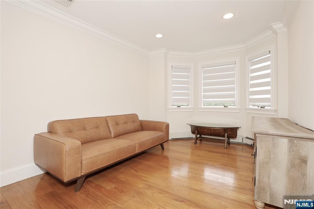 65 Ross Avenue Demarest, NJ 07627 - Photo 33 of 48 a living room with furniture and a wooden floor
