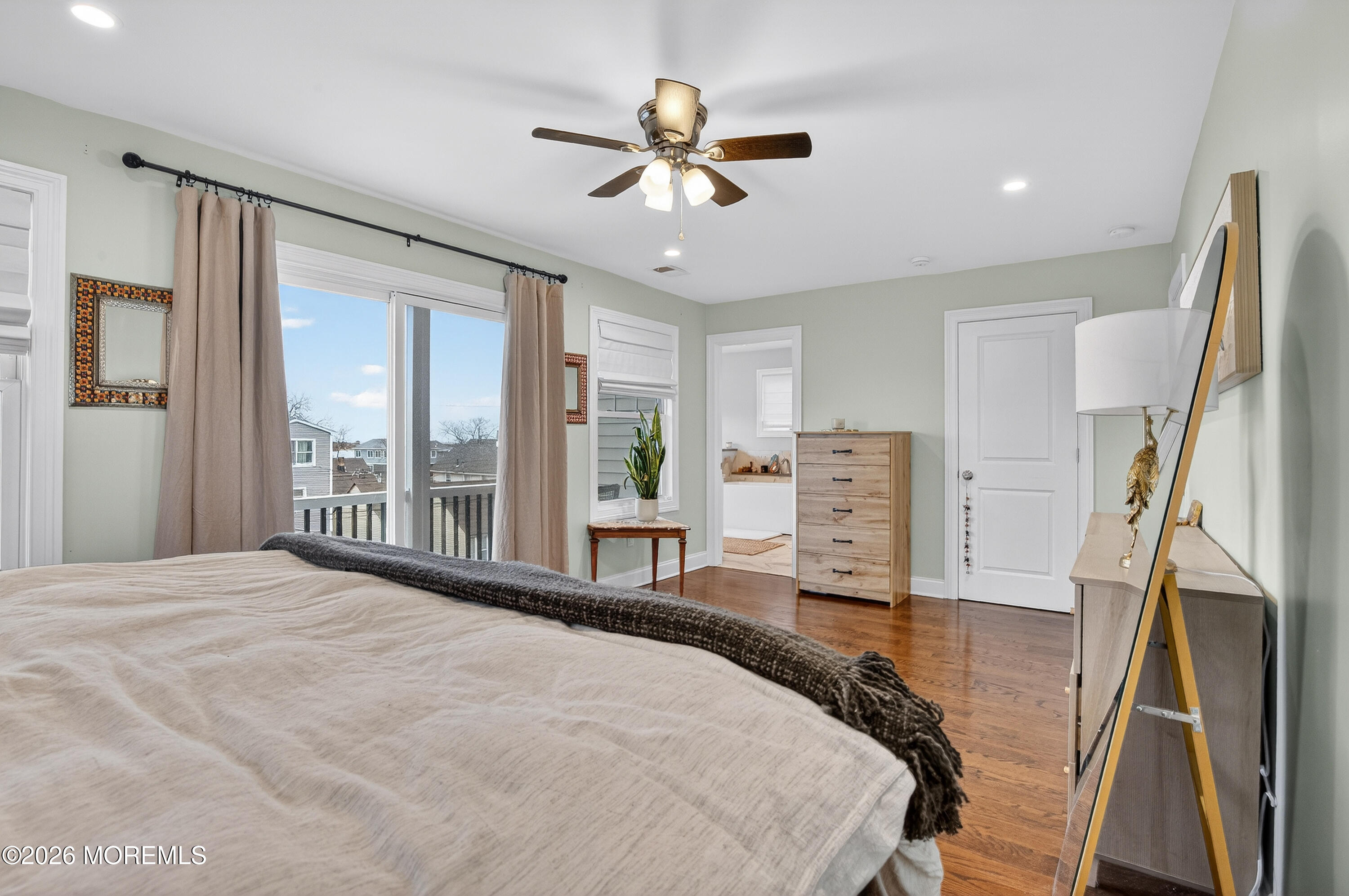 27 5th Street Highlands, NJ 07732 - Photo 21 of 62 a bed room with a bed and a flat tv screen