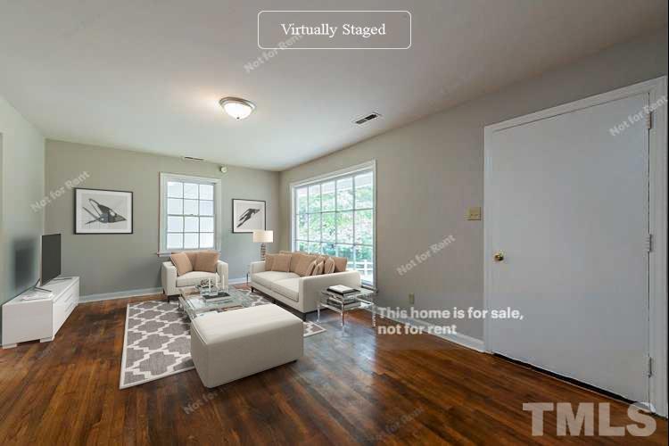 1217 Brighton Road Raleigh, NC 27610 - Photo 2 of 14 a living room with furniture and wooden floor