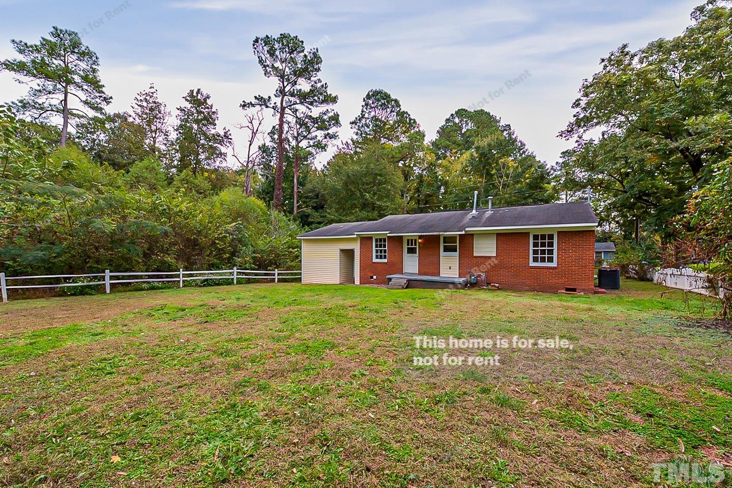 1217 Brighton Road Raleigh, NC 27610 - Photo 13 of 14 a view of a house with a yard
