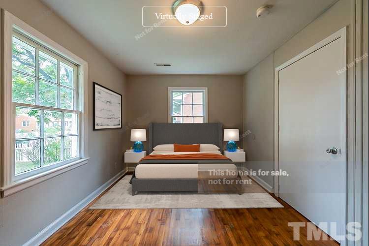 1217 Brighton Road Raleigh, NC 27610 - Photo 5 of 14 a bedroom with a bed and wooden floor
