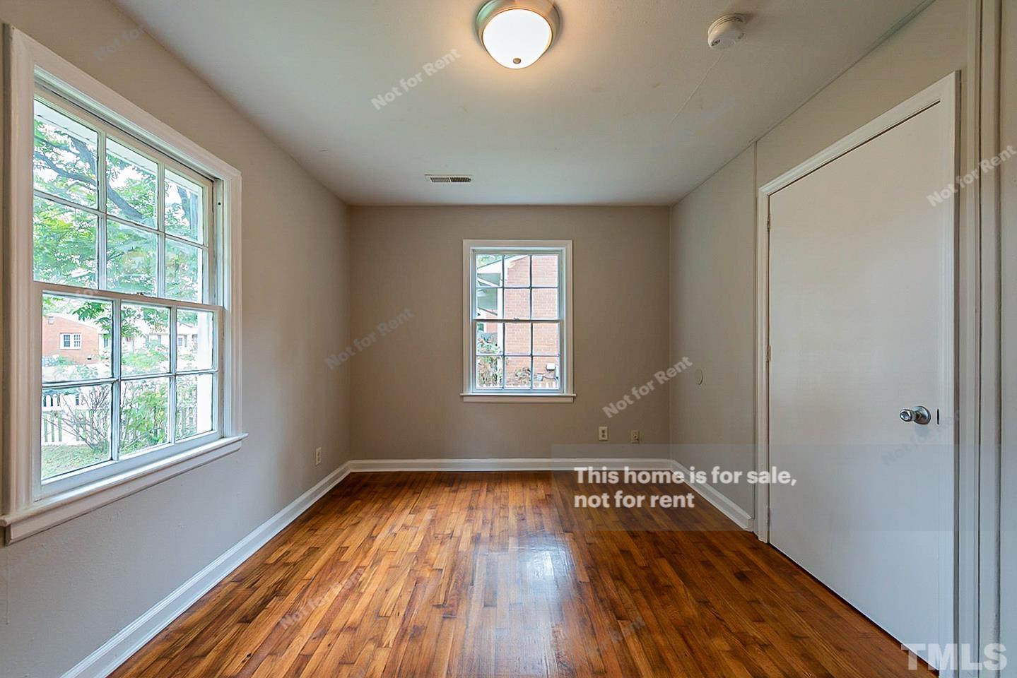 1217 Brighton Road Raleigh, NC 27610 - Photo 6 of 14 a view of empty room with wooden floor and fan