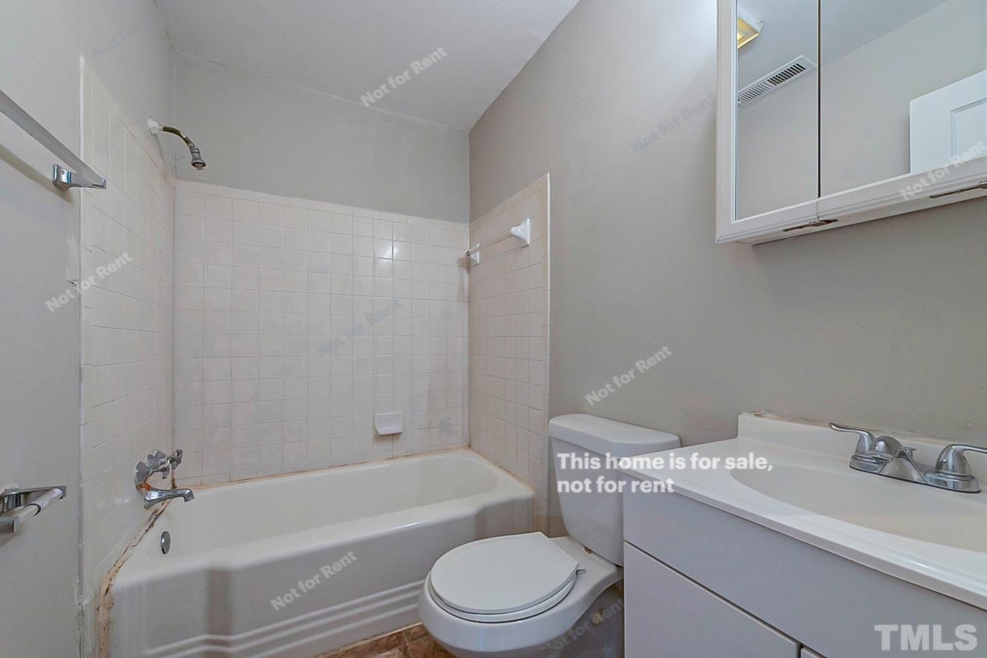 1217 Brighton Road Raleigh, NC 27610 - Photo 10 of 14 a bathroom with a sink toilet and shower