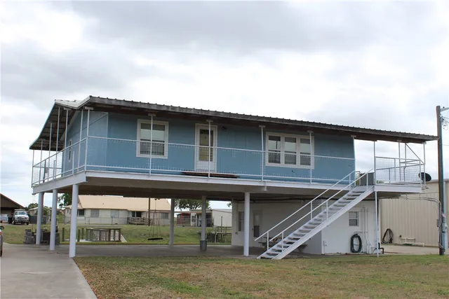 a view of a house with large windows