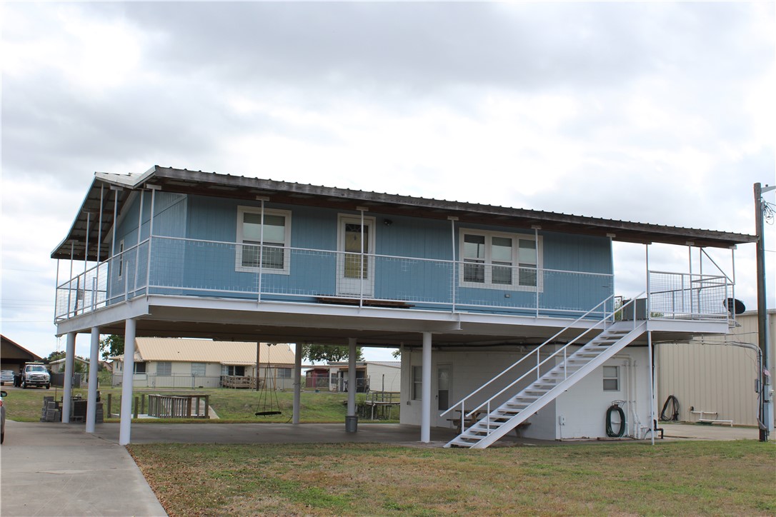 a view of a house with large windows