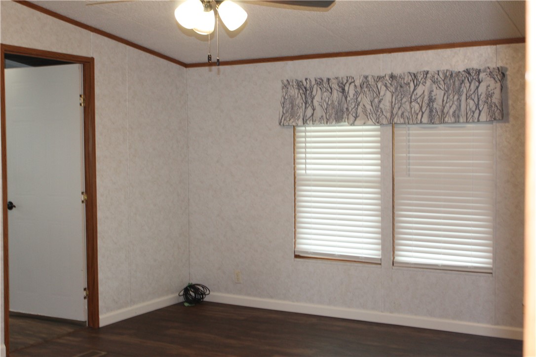 125 Lagarto Ferry Mathis, TX 78368 - Photo 12 of 38 a room with a window and wooden floor