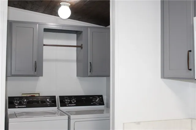a close view of a stove a microwave and cabinets