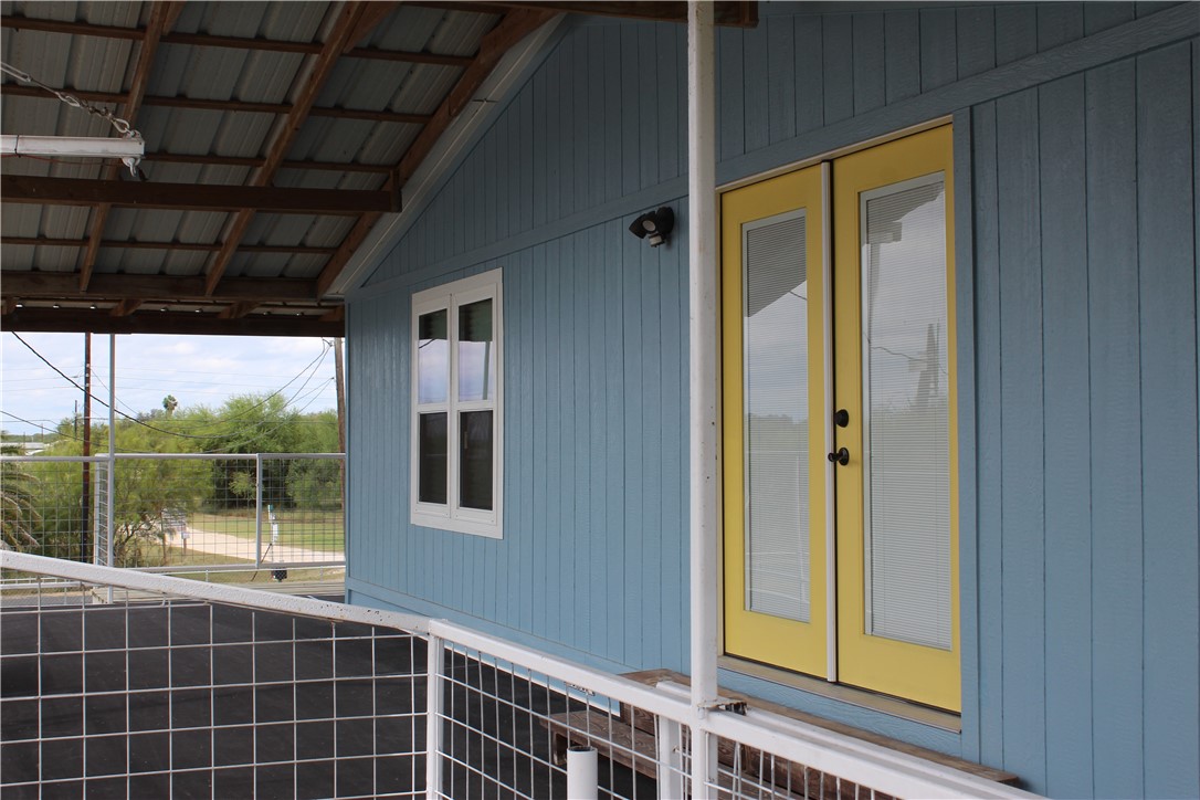 125 Lagarto Ferry Mathis, TX 78368 - Photo 22 of 38 a view of a door and wooden floor
