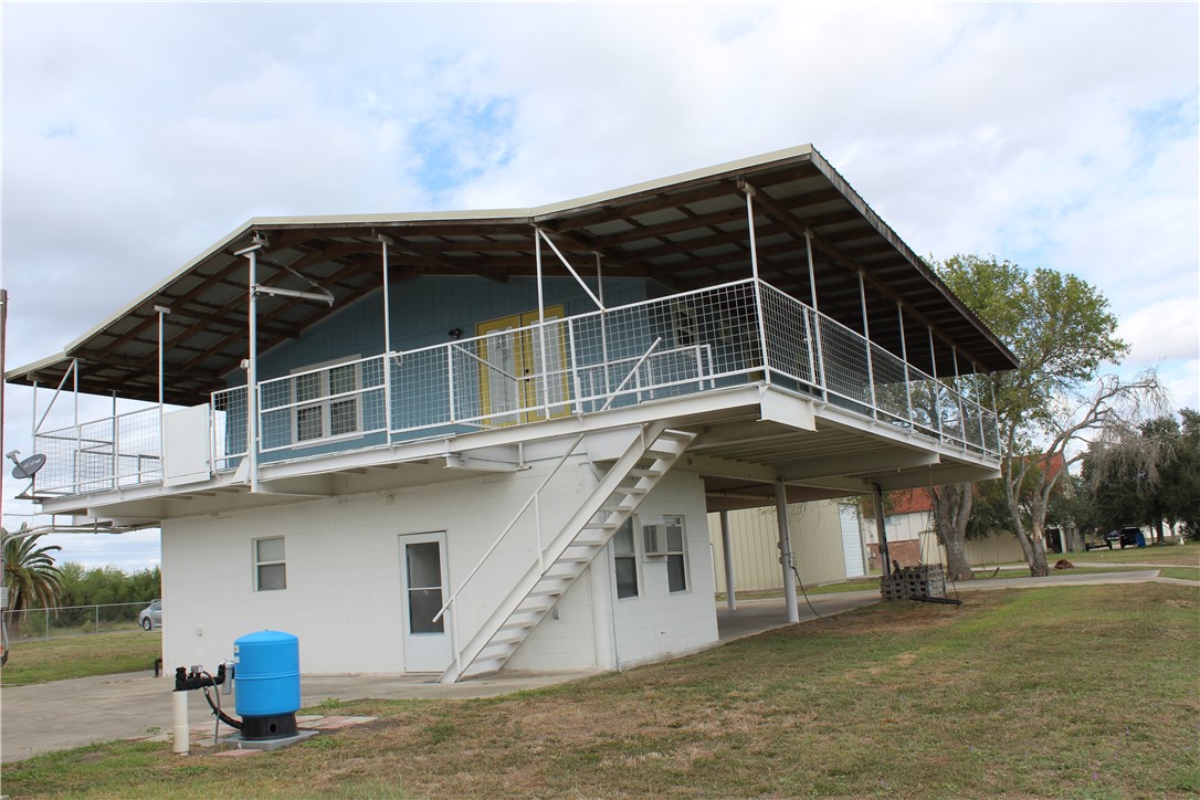 125 Lagarto Ferry Mathis, TX 78368 - Photo 3 of 38 a view of a house with a yard
